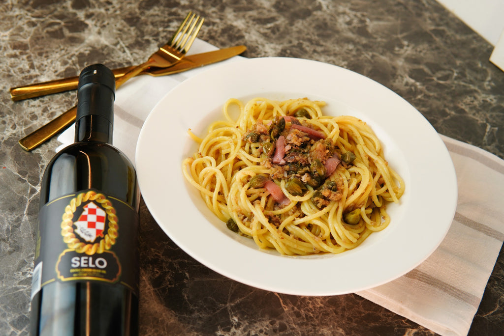 Traditional Croatian dish called gnjecopašta, meaning 'soggy pasta', made from spoiled pasta, anchovies, capers, and Croatian olive oil, symbolizing the resourcefulness of Croatian sailors.
