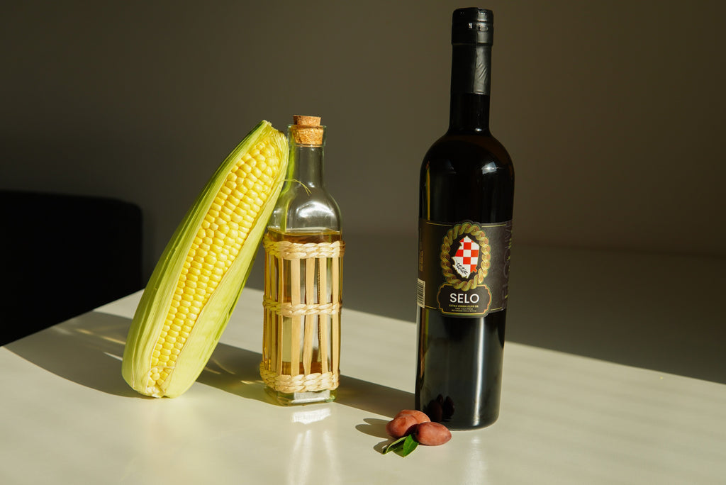 A single bottle of corn oil showcasing its distinctive golden-yellow color.