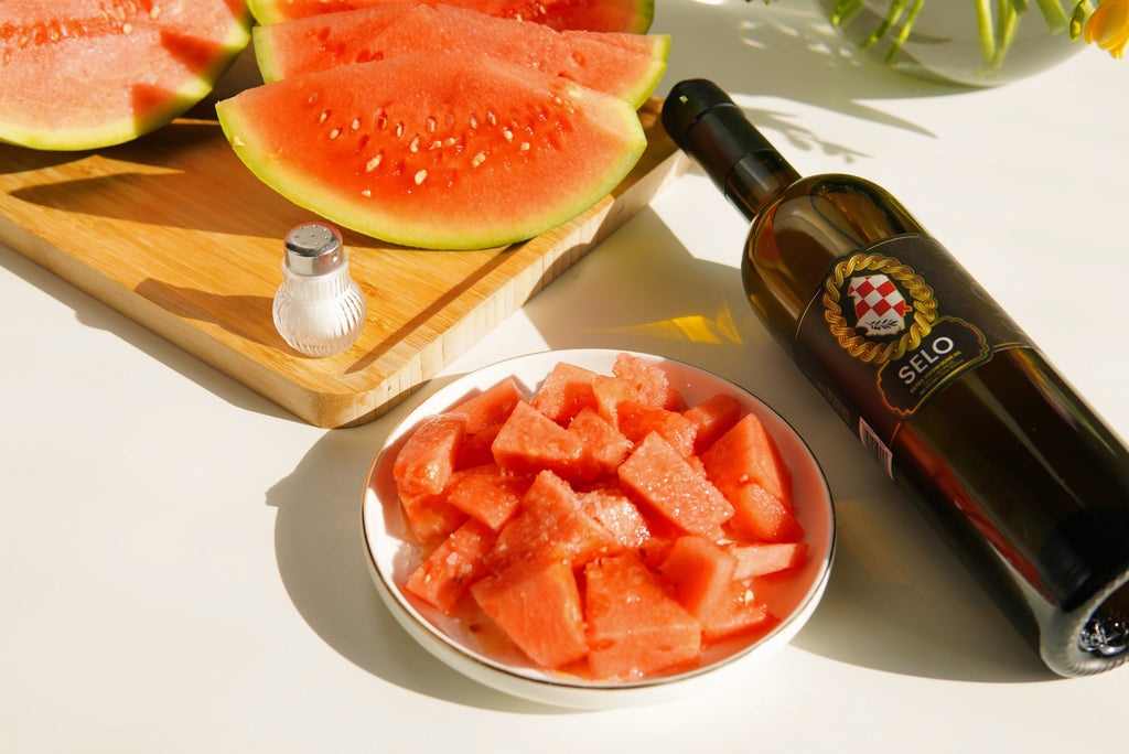 Refreshing summer treat - salted watermelon slices on a plate, perfect for beating the heat.